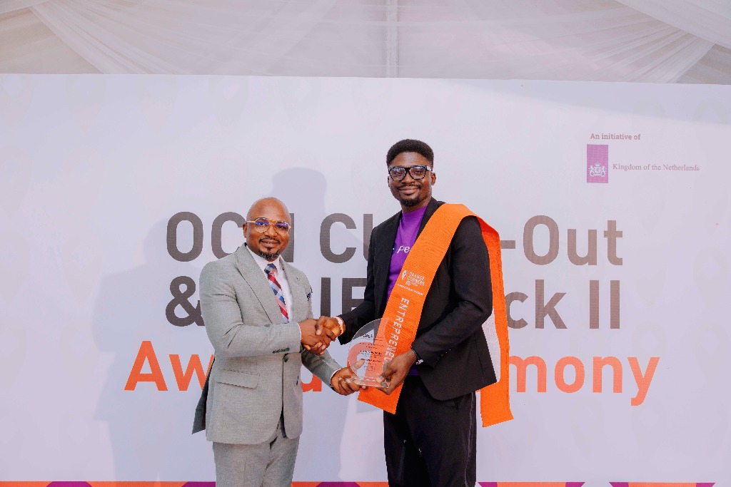 Jerry Nwobodo receiving Award of Excellence from Orange Corners Nigeria
